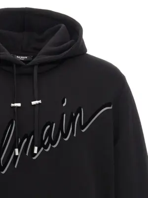 Velvet logo hoodie Man BALMAIN Black
